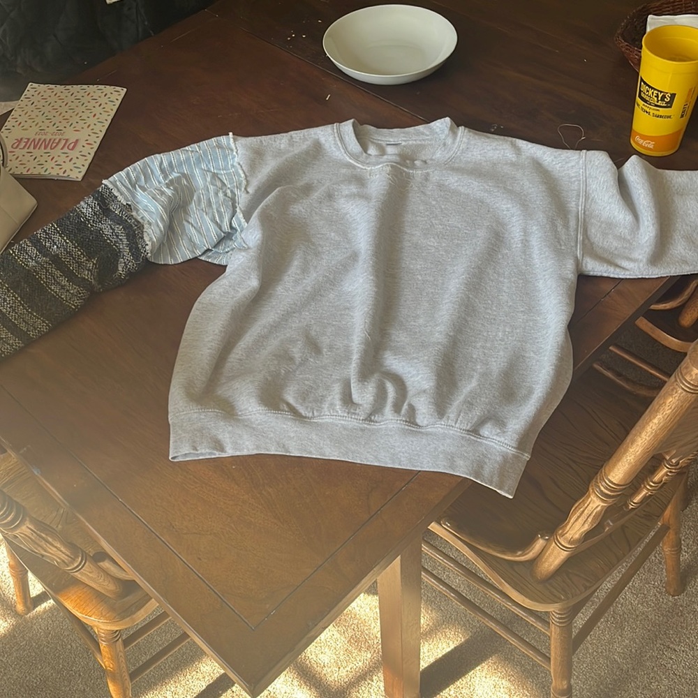 grey goldman shirt with a drug rug for the sleeve with a blue denim fabric